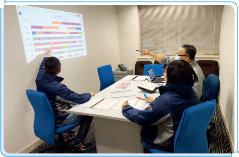 Staff members of OFCA having a discussion on spectrum planning.