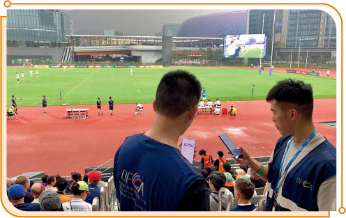 Staff members of OFCA conducting a measurement on 5G network performance during a rugby test event at the Youth Sports Ground of Kai Tak Sports Park.